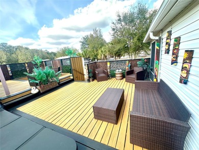 Step into your very own tropical oasis! This backyard is on The Links of Spruce Creek in Florida - for sale on GolfHomes.com, golf home, golf lot