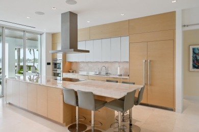 Experience the best of luxury living in this waterfront coastal on Sailfish Point Golf Club, Inc. in Florida - for sale on GolfHomes.com, golf home, golf lot