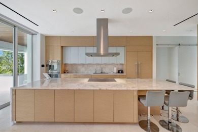 Experience the best of luxury living in this waterfront coastal on Sailfish Point Golf Club, Inc. in Florida - for sale on GolfHomes.com, golf home, golf lot