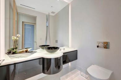 Experience the best of luxury living in this waterfront coastal on Sailfish Point Golf Club, Inc. in Florida - for sale on GolfHomes.com, golf home, golf lot