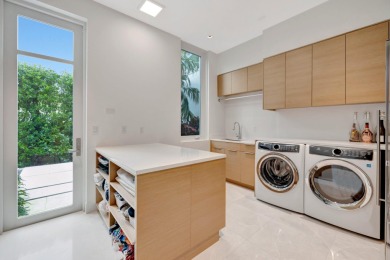 Experience the best of luxury living in this waterfront coastal on Sailfish Point Golf Club, Inc. in Florida - for sale on GolfHomes.com, golf home, golf lot