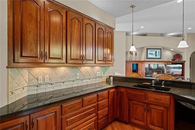 Experience the best of one-level living with peaceful lake views on TPC of the Twin Cities in Minnesota - for sale on GolfHomes.com, golf home, golf lot