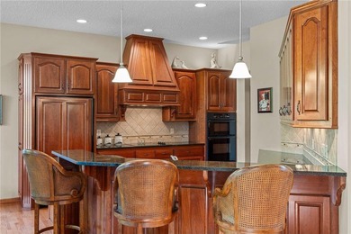 Experience the best of one-level living with peaceful lake views on TPC of the Twin Cities in Minnesota - for sale on GolfHomes.com, golf home, golf lot