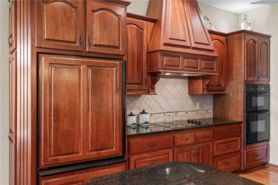 Experience the best of one-level living with peaceful lake views on TPC of the Twin Cities in Minnesota - for sale on GolfHomes.com, golf home, golf lot