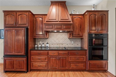 Experience the best of one-level living with peaceful lake views on TPC of the Twin Cities in Minnesota - for sale on GolfHomes.com, golf home, golf lot