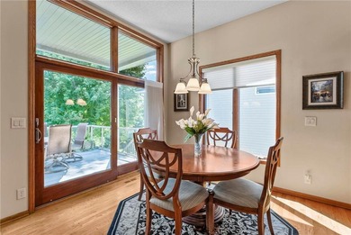 Experience the best of one-level living with peaceful lake views on TPC of the Twin Cities in Minnesota - for sale on GolfHomes.com, golf home, golf lot