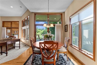 Experience the best of one-level living with peaceful lake views on TPC of the Twin Cities in Minnesota - for sale on GolfHomes.com, golf home, golf lot