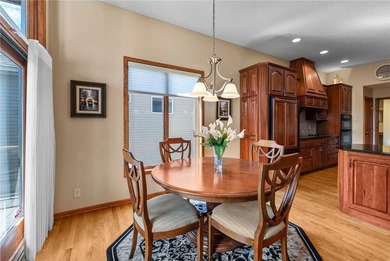 Experience the best of one-level living with peaceful lake views on TPC of the Twin Cities in Minnesota - for sale on GolfHomes.com, golf home, golf lot