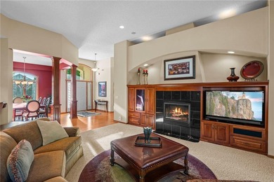 Experience the best of one-level living with peaceful lake views on TPC of the Twin Cities in Minnesota - for sale on GolfHomes.com, golf home, golf lot