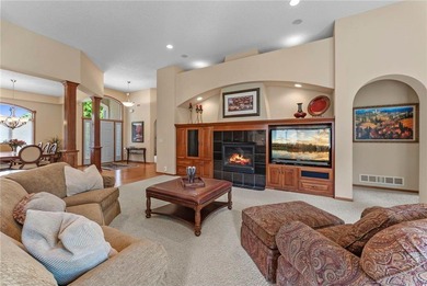 Experience the best of one-level living with peaceful lake views on TPC of the Twin Cities in Minnesota - for sale on GolfHomes.com, golf home, golf lot