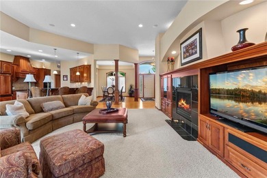 Experience the best of one-level living with peaceful lake views on TPC of the Twin Cities in Minnesota - for sale on GolfHomes.com, golf home, golf lot