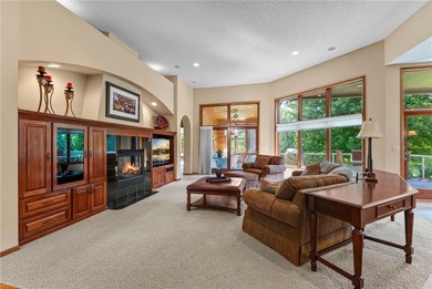 Experience the best of one-level living with peaceful lake views on TPC of the Twin Cities in Minnesota - for sale on GolfHomes.com, golf home, golf lot