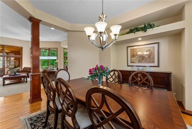 Experience the best of one-level living with peaceful lake views on TPC of the Twin Cities in Minnesota - for sale on GolfHomes.com, golf home, golf lot