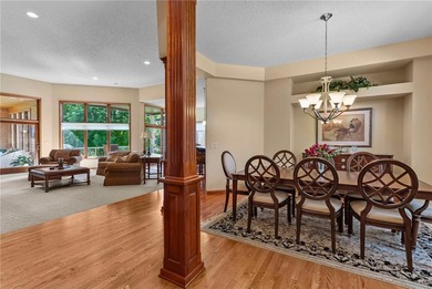 Experience the best of one-level living with peaceful lake views on TPC of the Twin Cities in Minnesota - for sale on GolfHomes.com, golf home, golf lot