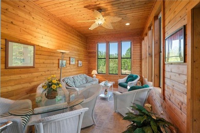 Experience the best of one-level living with peaceful lake views on TPC of the Twin Cities in Minnesota - for sale on GolfHomes.com, golf home, golf lot