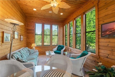 Experience the best of one-level living with peaceful lake views on TPC of the Twin Cities in Minnesota - for sale on GolfHomes.com, golf home, golf lot