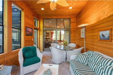 Experience the best of one-level living with peaceful lake views on TPC of the Twin Cities in Minnesota - for sale on GolfHomes.com, golf home, golf lot