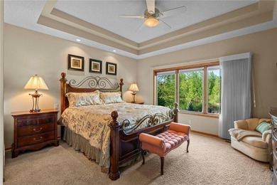 Experience the best of one-level living with peaceful lake views on TPC of the Twin Cities in Minnesota - for sale on GolfHomes.com, golf home, golf lot