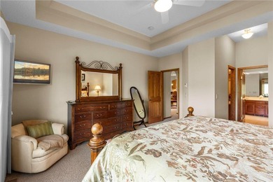 Experience the best of one-level living with peaceful lake views on TPC of the Twin Cities in Minnesota - for sale on GolfHomes.com, golf home, golf lot