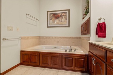 Experience the best of one-level living with peaceful lake views on TPC of the Twin Cities in Minnesota - for sale on GolfHomes.com, golf home, golf lot