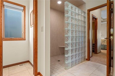 Experience the best of one-level living with peaceful lake views on TPC of the Twin Cities in Minnesota - for sale on GolfHomes.com, golf home, golf lot