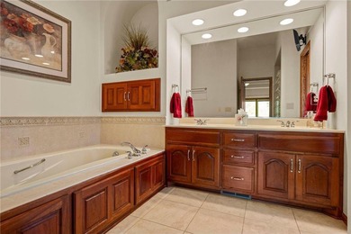 Experience the best of one-level living with peaceful lake views on TPC of the Twin Cities in Minnesota - for sale on GolfHomes.com, golf home, golf lot