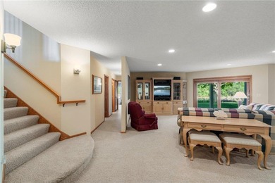 Experience the best of one-level living with peaceful lake views on TPC of the Twin Cities in Minnesota - for sale on GolfHomes.com, golf home, golf lot