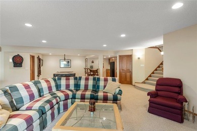Experience the best of one-level living with peaceful lake views on TPC of the Twin Cities in Minnesota - for sale on GolfHomes.com, golf home, golf lot
