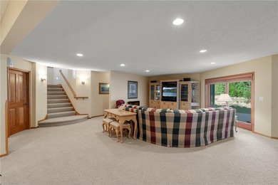 Experience the best of one-level living with peaceful lake views on TPC of the Twin Cities in Minnesota - for sale on GolfHomes.com, golf home, golf lot