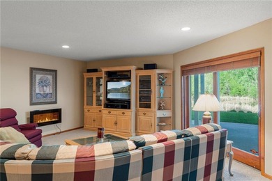 Experience the best of one-level living with peaceful lake views on TPC of the Twin Cities in Minnesota - for sale on GolfHomes.com, golf home, golf lot