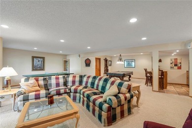 Experience the best of one-level living with peaceful lake views on TPC of the Twin Cities in Minnesota - for sale on GolfHomes.com, golf home, golf lot