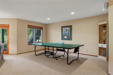 Experience the best of one-level living with peaceful lake views on TPC of the Twin Cities in Minnesota - for sale on GolfHomes.com, golf home, golf lot