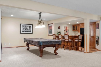 Experience the best of one-level living with peaceful lake views on TPC of the Twin Cities in Minnesota - for sale on GolfHomes.com, golf home, golf lot