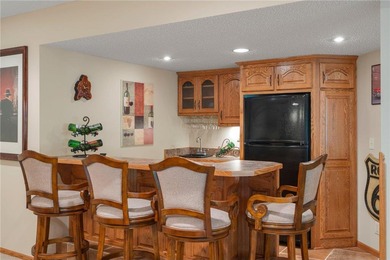 Experience the best of one-level living with peaceful lake views on TPC of the Twin Cities in Minnesota - for sale on GolfHomes.com, golf home, golf lot