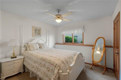 Experience the best of one-level living with peaceful lake views on TPC of the Twin Cities in Minnesota - for sale on GolfHomes.com, golf home, golf lot