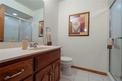 Experience the best of one-level living with peaceful lake views on TPC of the Twin Cities in Minnesota - for sale on GolfHomes.com, golf home, golf lot