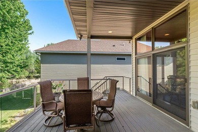 Experience the best of one-level living with peaceful lake views on TPC of the Twin Cities in Minnesota - for sale on GolfHomes.com, golf home, golf lot