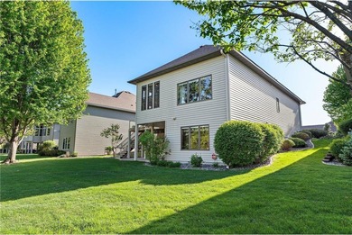 Experience the best of one-level living with peaceful lake views on TPC of the Twin Cities in Minnesota - for sale on GolfHomes.com, golf home, golf lot