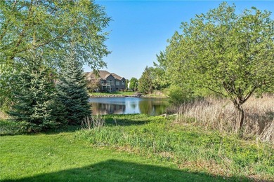 Experience the best of one-level living with peaceful lake views on TPC of the Twin Cities in Minnesota - for sale on GolfHomes.com, golf home, golf lot