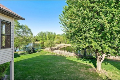 Experience the best of one-level living with peaceful lake views on TPC of the Twin Cities in Minnesota - for sale on GolfHomes.com, golf home, golf lot