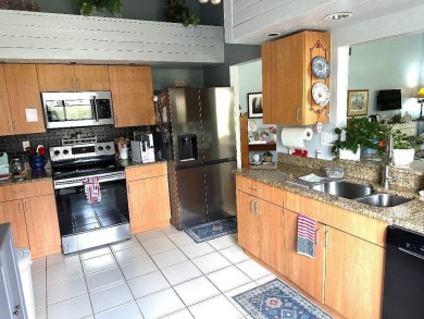 Welcome home to your single-story home with double garage on a on Atlantic National Golf and Country Club in Florida - for sale on GolfHomes.com, golf home, golf lot