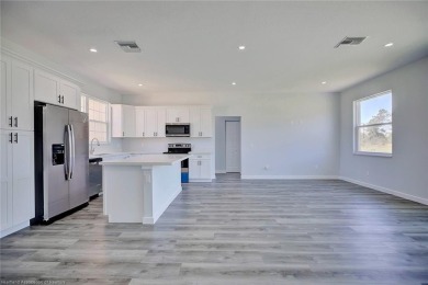 This is a stunning, brand new, never lived in, 3 bedrooms, 2 on Placid Lakes Country Club in Florida - for sale on GolfHomes.com, golf home, golf lot