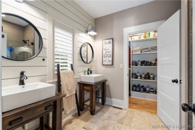 This fully remodeled home offers the perfect blend of privacy on Osage National Golf Club in Missouri - for sale on GolfHomes.com, golf home, golf lot