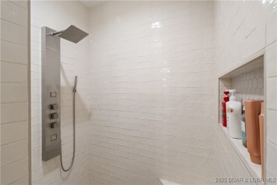 This fully remodeled home offers the perfect blend of privacy on Osage National Golf Club in Missouri - for sale on GolfHomes.com, golf home, golf lot