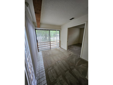 Spacious 2/2 condo with bonus room and covered balcony on on Hilaman Park Golf Course in Florida - for sale on GolfHomes.com, golf home, golf lot