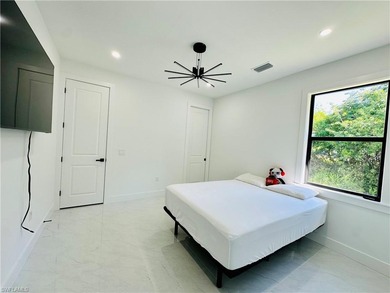 Experience the best of Golden Gate Estates living in this on The Club At Twin Eagles in Florida - for sale on GolfHomes.com, golf home, golf lot