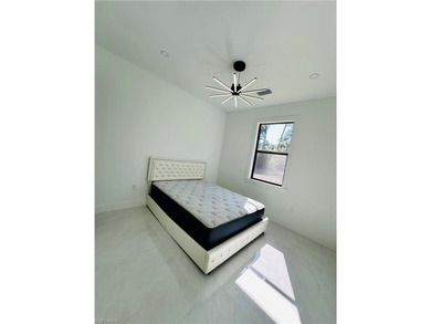 Experience the best of Golden Gate Estates living in this on The Club At Twin Eagles in Florida - for sale on GolfHomes.com, golf home, golf lot