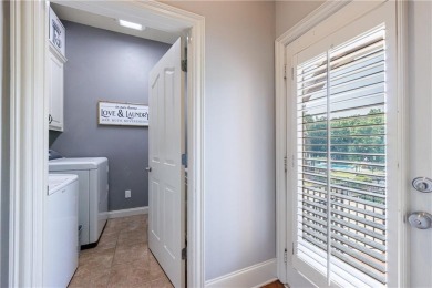 Discover this exceptional executive home situated on a serene 1 on Trophy Club of Apalachee in Georgia - for sale on GolfHomes.com, golf home, golf lot