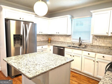 No HOA - Discover the perfect blend of contemporary elegance and on Charlie Yates Golf Course in Georgia - for sale on GolfHomes.com, golf home, golf lot