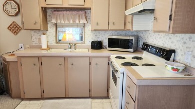 TWO BED, ONE BATH HOME IN ACTIVE 55+ COMMUNITY! This furnished on River Run Golf Links in Florida - for sale on GolfHomes.com, golf home, golf lot